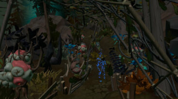 A bunch of colorful plants supported by wooden structures with a blue outline of a person in the middle