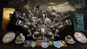 A large statue of a man in a gas mask, various radiation symbols, guns, and a few humanoid monsters with tentacles coming out of their mouths