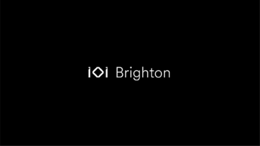 A black image with the IOI logo and Brighton next to it