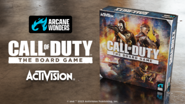 The Call of Duty Board Game box on a wooden floor with the logo for the game and companies next to it