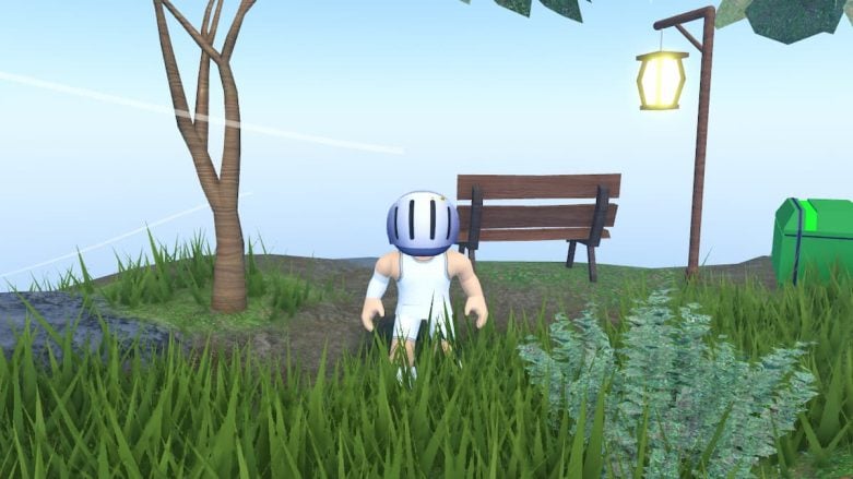 A Roblox character with a white and blue basketball helmet is seen from behind, crouching in a lush green field with tall grass. To the right, there’s a wooden bench next to a streetlamp, and on the left, a green trash bin. In the background, there’s a tree and the hint of a clear sky with sunlight streaming through.