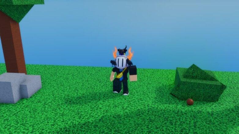 Roblox Baby Kicking Simulator Avatar Wearing Silver Helmet And Massive Left Arm Standing On Grass With Trees And Bushes Nearby
