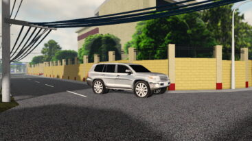 Roblox Diesel N Steel A Silver Suv Is Parked On A Paved Road With A Yellow Brick Wall And A Black Metal Fence In The Background Under A Power Line Grid