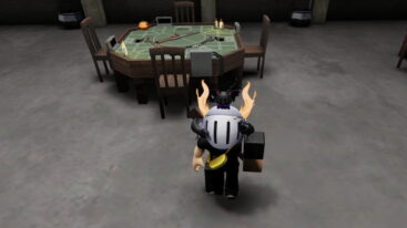 Roblox Buckshot A Silver Helmeted Avatar With A Black Cat On Their Shoulder Stands On A Grey Floor Facing A Wooden Gaming Table With A Shotgun And Candles In The Center