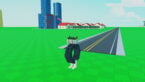 Roblox Become The Biggest Brainrot A Brainrot That Looks Like A Frog Tyre Standing Near Road With A Blue Building With Letter R On It