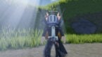 Roblox Cardborn Rng Avatar Wearing Silver Helmet Black Clothes Two Giant Swords Standing On Dirt Parth With Grass And Sunlight Behind With Words Scarecrow 1 In 2
