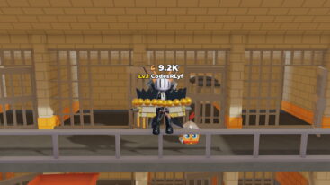 Roblox Train Arm To Punch Avatar Wearing Silver Helmet Black Clothes Two Giant Swords On Back Wearing Massive Golden Punching Gloves Near Cell Blocks