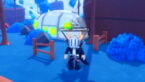 Roblox Anime Crash Avatar Wearing Silver Helmet Black Clothes Two Giant Swords On Back Standing On Blue Grass Near Wooden Fence And White Building