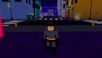 Roblox Become Superhero A Brown Haired Smiling Avatar Wearing A Bad Batman Costume In The City Streets